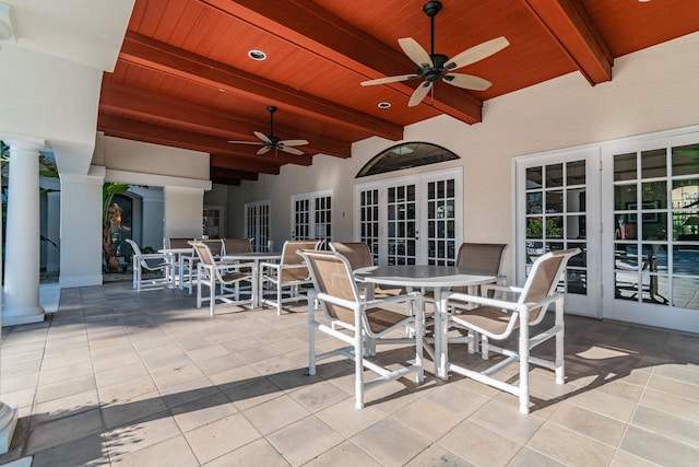 view of patio with french doors, outdoor dining area, and a ceiling fan