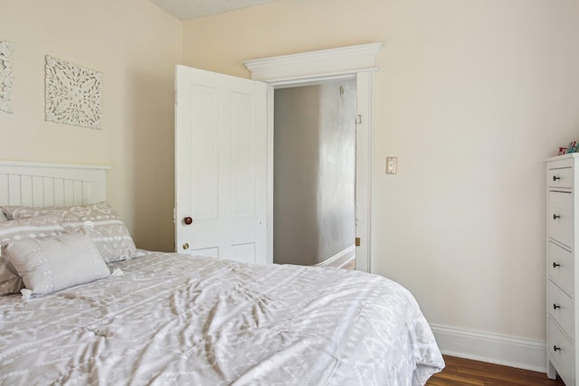 127 M L King Ave, Saint Augustine, FL 32084 - bedroom featuring dark wood-style flooring and baseboards