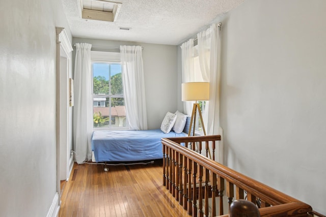 127 M L King Ave, Saint Augustine, FL 32084 - bedroom featuring hardwood / wood-style flooring and a textured ceiling
