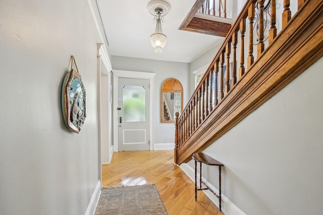 127 M L King Ave, Saint Augustine, FL 32084 - entryway featuring stairs, baseboards, and light wood finished floors