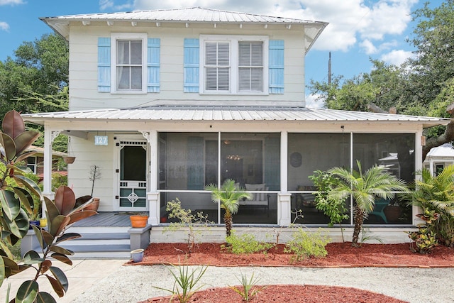 127 M L King Ave, Saint Augustine, FL 32084 - view of front of house with a sunroom and metal roof
