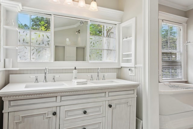 127 M L King Ave, Saint Augustine, FL 32084 - bathroom featuring crown molding, double vanity, and plenty of natural light