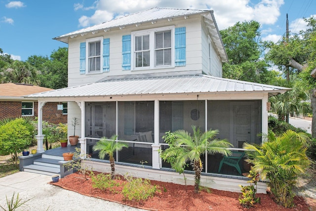 127 M L King Ave, Saint Augustine, FL 32084 - view of front of house with a sunroom and metal roof