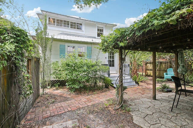 127 M L King Ave, Saint Augustine, FL 32084 - back of house featuring a patio and metal roof