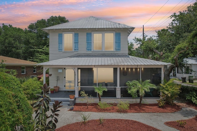 127 M L King Ave, Saint Augustine, FL 32084 - view of front of house with metal roof and a sunroom