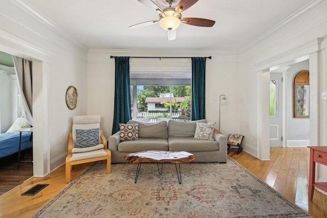 127 M L King Ave, Saint Augustine, FL 32084 - living area with hardwood / wood-style flooring, ornamental molding, ceiling fan, and baseboards