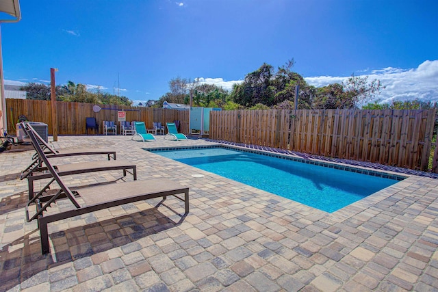 view of pool featuring a patio area