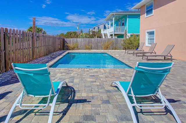 view of swimming pool featuring a patio