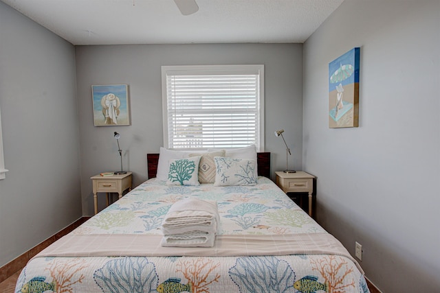 bedroom with hardwood / wood-style floors and ceiling fan