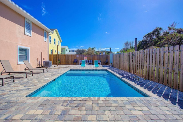 view of pool featuring central AC unit