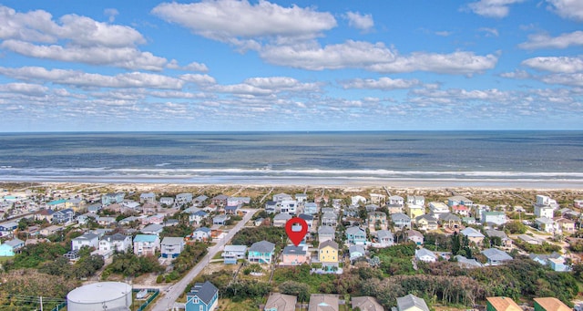 drone / aerial view with a water view and a view of the beach