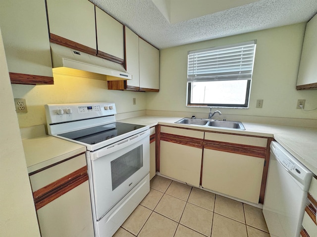 221 Mayan Ter, Saint Augustine, FL 32080 - kitchen with white appliances, premium range hood, light countertops, light tile patterned floors, and a textured ceiling