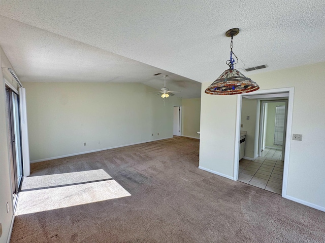 221 Mayan Ter, Saint Augustine, FL 32080 - empty room featuring carpet, a textured ceiling, a ceiling fan, and lofted ceiling