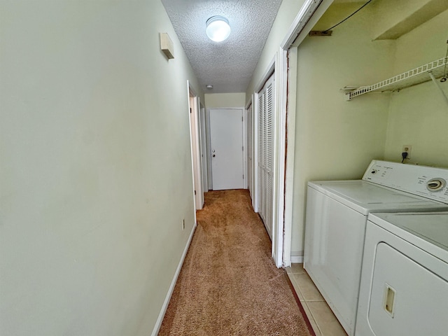 221 Mayan Ter, Saint Augustine, FL 32080 - laundry area with washing machine and dryer, a textured ceiling, and light carpet