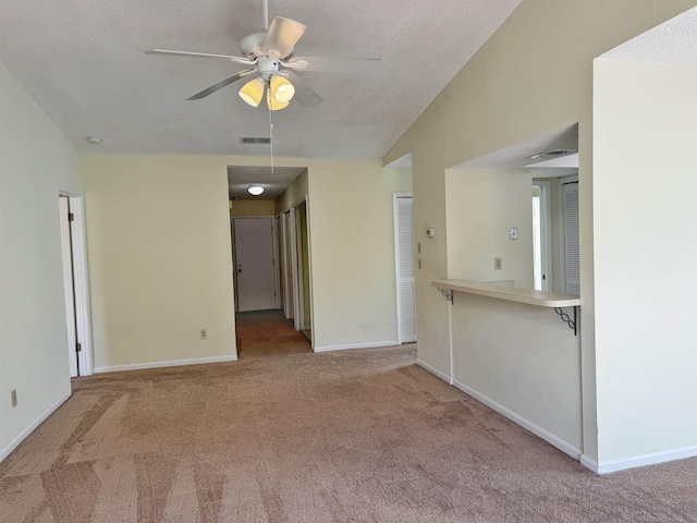 221 Mayan Ter, Saint Augustine, FL 32080 - carpeted empty room with ceiling fan, lofted ceiling, and a textured ceiling