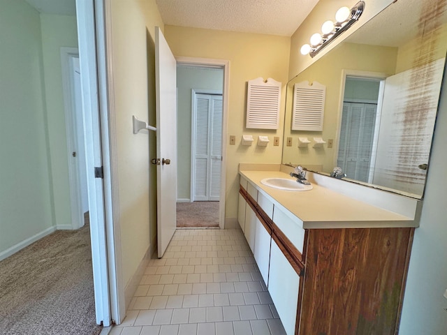 221 Mayan Ter, Saint Augustine, FL 32080 - bathroom with vanity, a textured ceiling, and tile patterned flooring