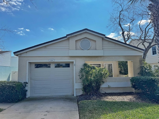 221 Mayan Ter, Saint Augustine, FL 32080 - ranch-style house with a garage, driveway, and stucco siding
