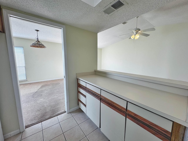 221 Mayan Ter, Saint Augustine, FL 32080 - hall with light colored carpet, a textured ceiling, and light tile patterned floors