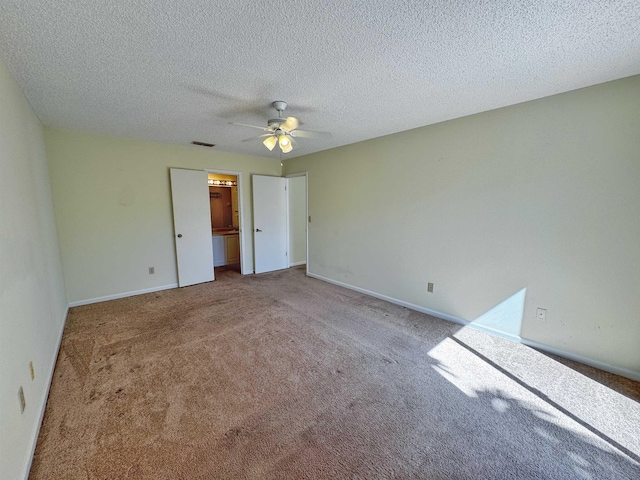 221 Mayan Ter, Saint Augustine, FL 32080 - unfurnished bedroom with carpet, a ceiling fan, and a textured ceiling