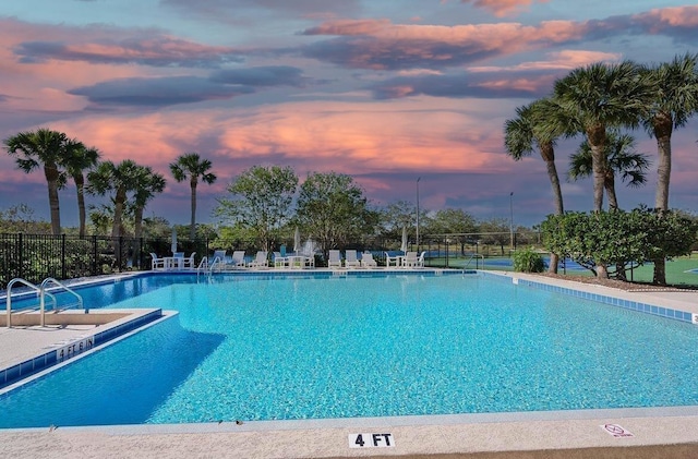 221 Mayan Ter, Saint Augustine, FL 32080 - pool at dusk featuring a community pool and a patio area