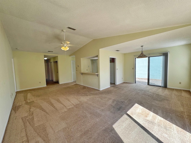 221 Mayan Ter, Saint Augustine, FL 32080 - unfurnished living room with carpet, a ceiling fan, lofted ceiling, and a textured ceiling