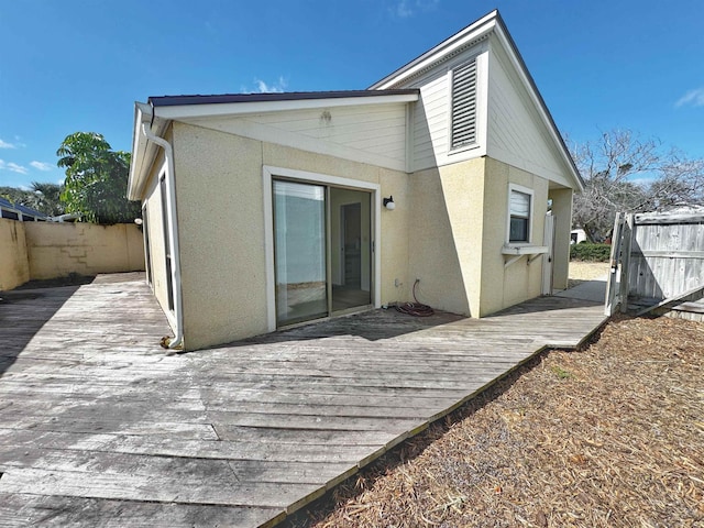 221 Mayan Ter, Saint Augustine, FL 32080 - back of property featuring stucco siding and a deck