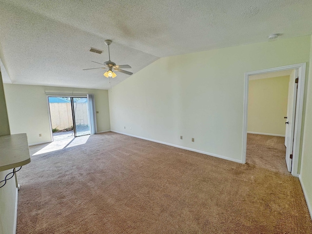 221 Mayan Ter, Saint Augustine, FL 32080 - carpeted empty room with a ceiling fan, a textured ceiling, vaulted ceiling, and a smoke detector