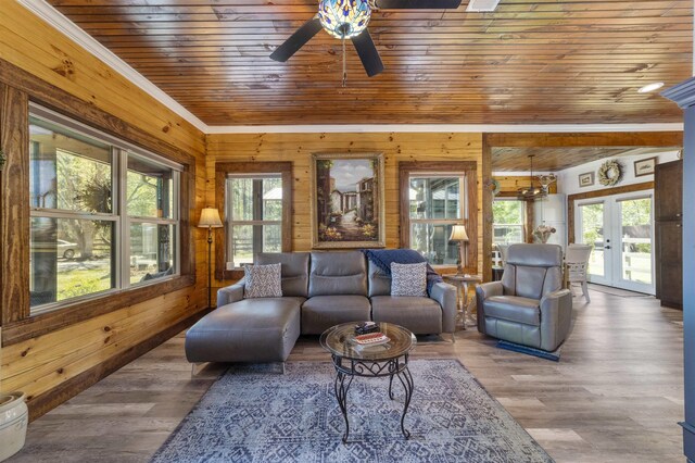 10635 Beckenger Ave, Hastings, FL 32145 - living area featuring wood finished floors, wooden walls, wooden ceiling, and a ceiling fan