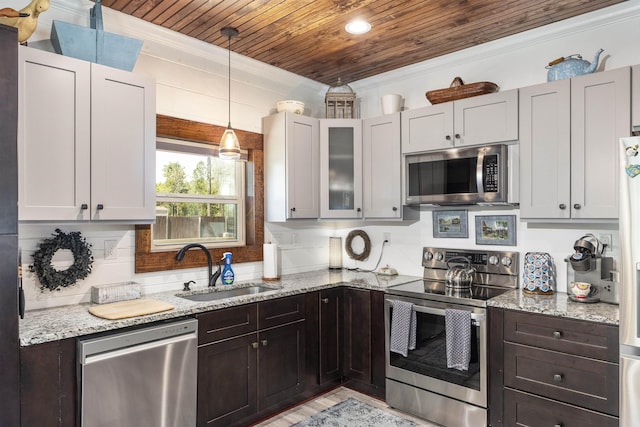 10635 Beckenger Ave, Hastings, FL 32145 - kitchen featuring ornamental molding, wooden ceiling, a sink, light stone countertops, and appliances with stainless steel finishes