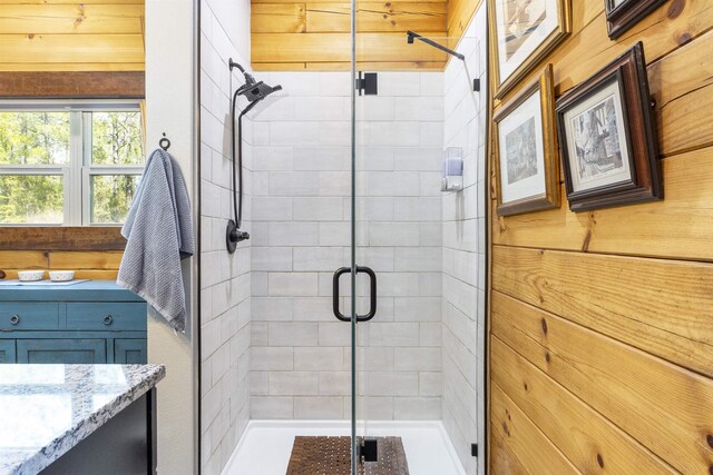 10635 Beckenger Ave, Hastings, FL 32145 - full bathroom featuring wood walls, a stall shower, and vanity