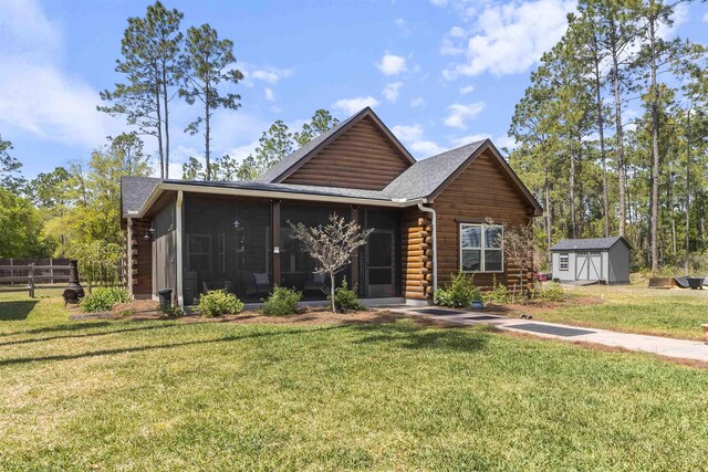 10635 Beckenger Ave, Hastings, FL 32145 - log home featuring a sunroom, a storage shed, log exterior, a front yard, and an outbuilding