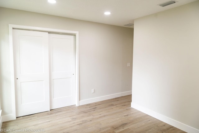 552 Fox Hollow Ln, Saint Augustine, FL 32086 - unfurnished bedroom with light wood-style floors, recessed lighting, and a closet