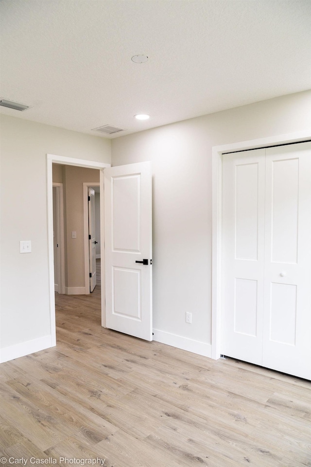 552 Fox Hollow Ln, Saint Augustine, FL 32086 - unfurnished bedroom featuring light wood-type flooring, a closet, and recessed lighting