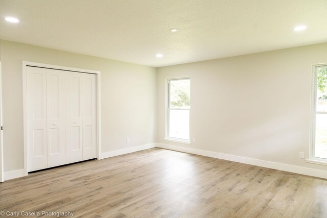 552 Fox Hollow Ln, Saint Augustine, FL 32086 - unfurnished bedroom featuring recessed lighting, light wood-style floors, and a closet