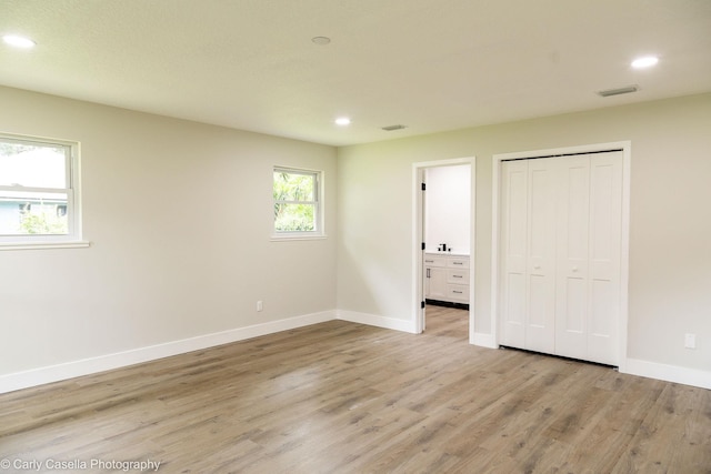 552 Fox Hollow Ln, Saint Augustine, FL 32086 - unfurnished bedroom with recessed lighting, light wood finished floors, a closet, and connected bathroom