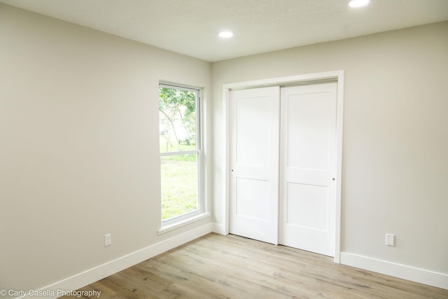 552 Fox Hollow Ln, Saint Augustine, FL 32086 - unfurnished bedroom with recessed lighting, light wood finished floors, and a closet