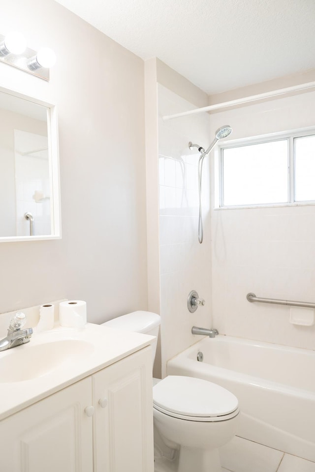 full bathroom with tile patterned flooring, vanity, washtub / shower combination, and toilet