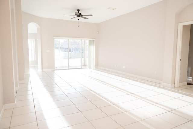 spare room featuring ceiling fan and light tile patterned floors