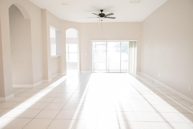 spare room with light tile patterned floors and ceiling fan