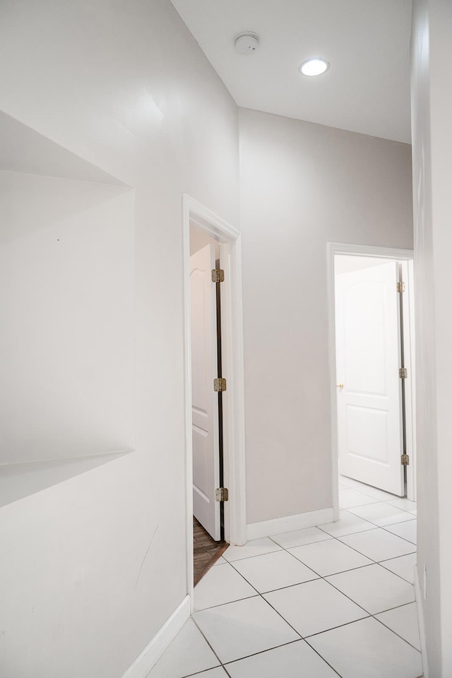 hallway with light tile patterned flooring