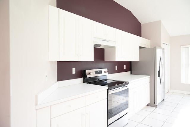 kitchen featuring white cabinetry, appliances with stainless steel finishes, vaulted ceiling, and light tile patterned floors