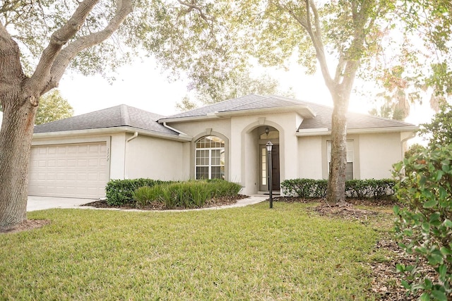 view of front facade with a garage and a front yard