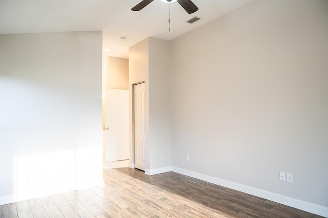 empty room with ceiling fan and light wood-type flooring