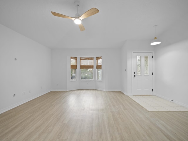 unfurnished living room with ceiling fan and light hardwood / wood-style floors