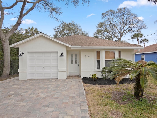 single story home featuring a garage