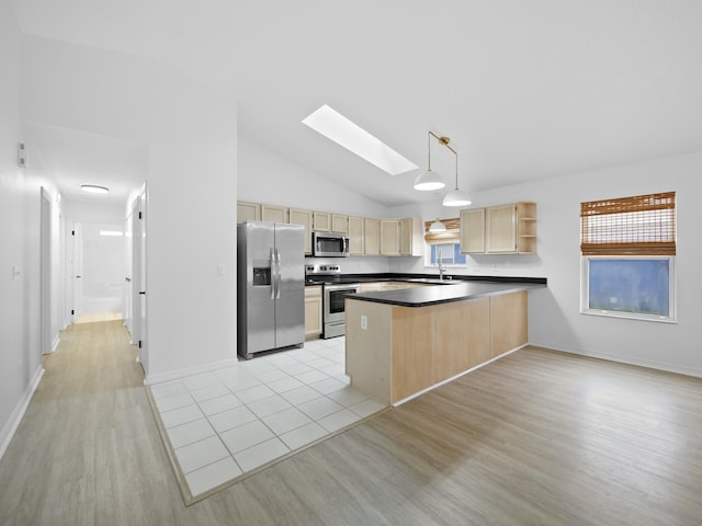 kitchen featuring sink, appliances with stainless steel finishes, light brown cabinetry, decorative light fixtures, and kitchen peninsula