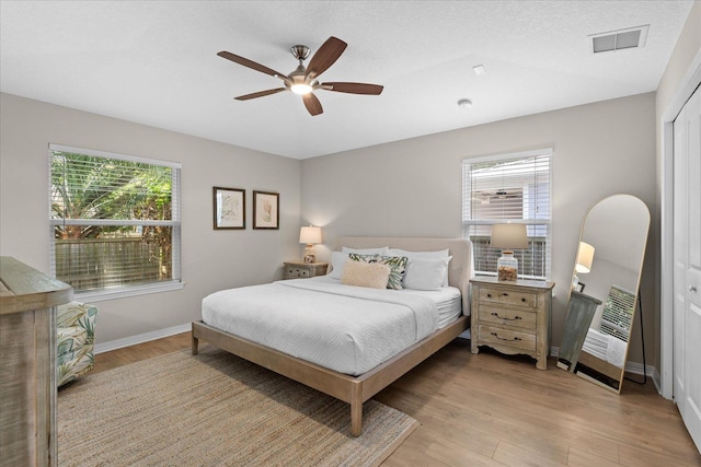 403 Second St, Saint Augustine, FL 32084 - bedroom with visible vents, light wood-style flooring, multiple windows, and baseboards