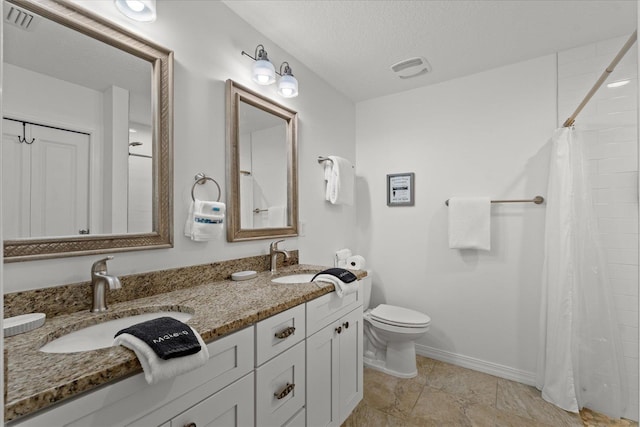 403 Second St, Saint Augustine, FL 32084 - full bath featuring baseboards, toilet, double vanity, and a sink