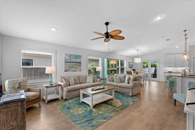 403 Second St, Saint Augustine, FL 32084 - living area featuring light wood-type flooring, a ceiling fan, visible vents, a textured ceiling, and french doors