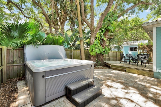 403 Second St, Saint Augustine, FL 32084 - deck with a patio, outdoor dining space, a fenced backyard, and a hot tub